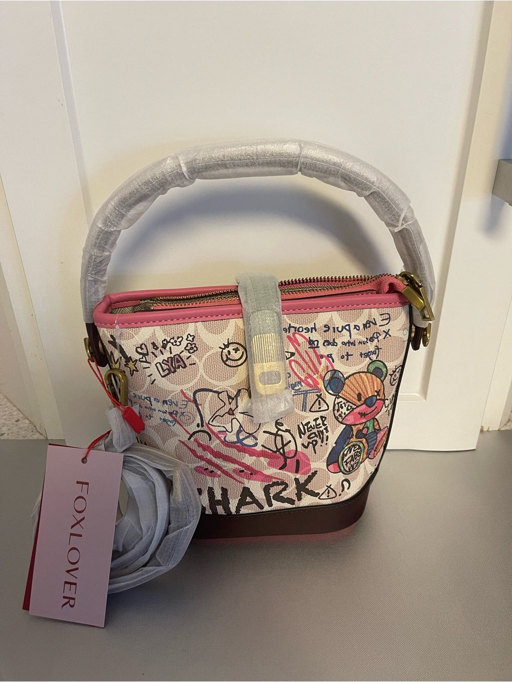 Foxer Women’s Graffiti Bucket Print Fashion Handbag Crossbody Bag Brown/Pink
